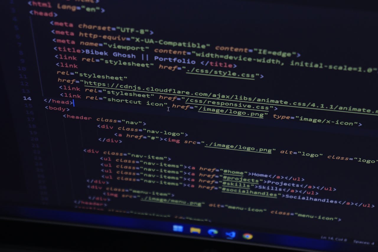 High-resolution close-up of HTML code displayed on a computer screen, perfect for technology themes.
